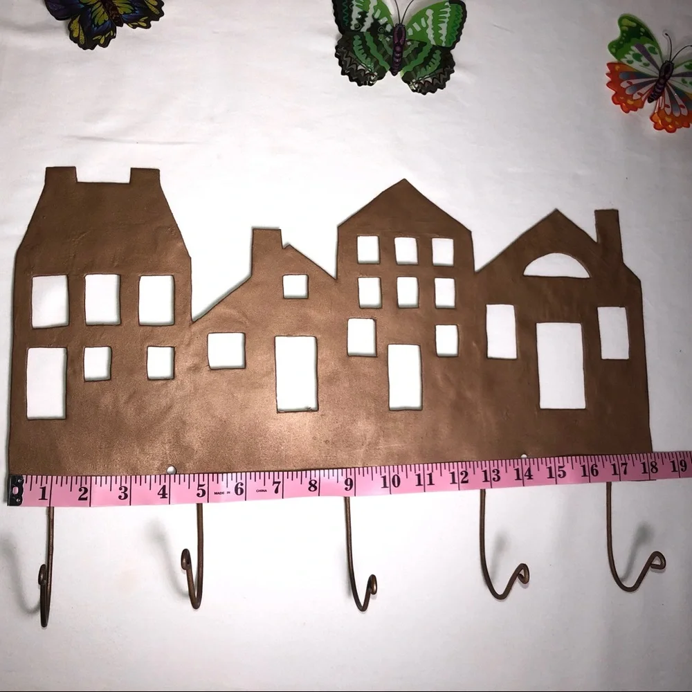 Copper painted metal house wall hanger with hooks, pre-owned